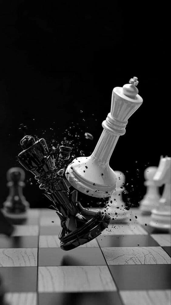 A white chess king striking and shattering a black king